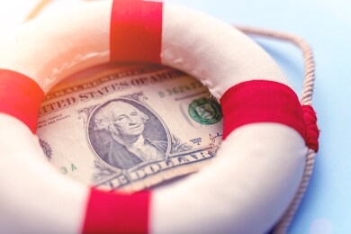 abstract fast emergency rescue business financial economics crisis. concept of fix economy financial crisis in usa or global world economy. lifebuoy on us dollar paper banknote bill background.
