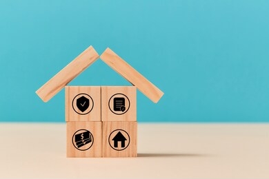investment insurance. life and house protection. insurance policy concept. wooden cubes with sign on ground. copy space