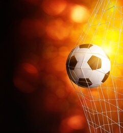 soccer ball in goal with spotlight