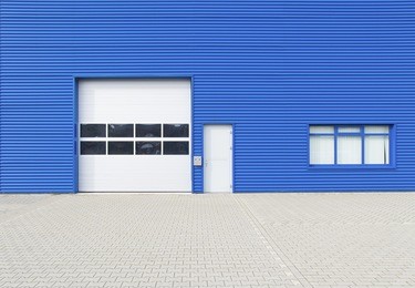 facade of a modern blue warehouse