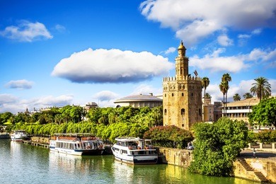 golden tower (torre del oro) along the guadalquivir river, seville (andalusia), spain. 