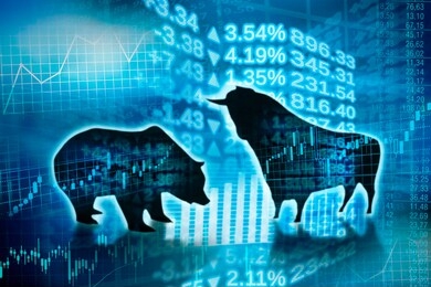 silhouette of bull and bear and symbols of digital trade on the markets