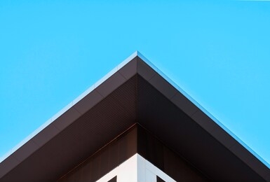 abstract symmetry geometry triangular high building on blue sky