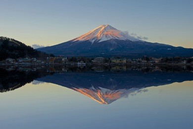 mount fuji reflected in lake kawaguchi at dawn