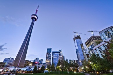 a park in downtown toronto with high rise building as background
