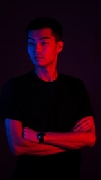 business portrait of an asian guy with color light blue and red