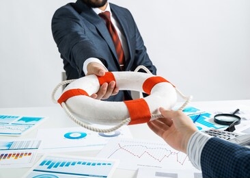 business persons holding lifebuoy together. business assistance and professional law consultation. corporate teamwork and partnership. insurance services for business. independent audit and consulting