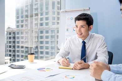 young smart handsome asian businessman in the meeting at city office