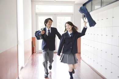 japanese students walking down hallway