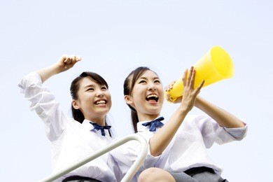 japanese girls holding a megaphone to cheer