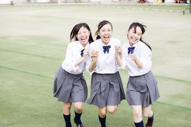 female japanese students laughing together