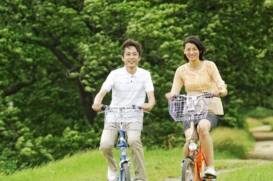 japanese couple riding a bicycle
