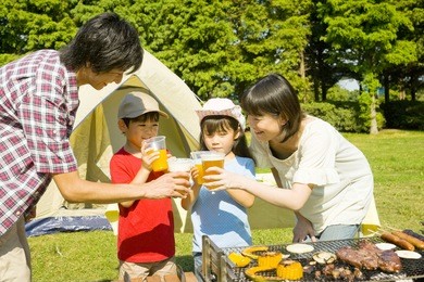 japanese family drinking the toast in the barbecue party