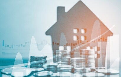 double exposure of coins stack and home model with business graph in concept of money save. 
