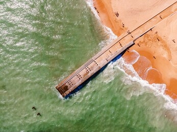 aerial view of pier and beach in albufeira, algarve, portugal