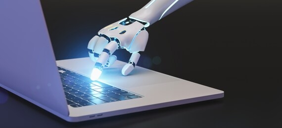 hand of a ai or ki robot is using the keyboard of an computer or laptop 