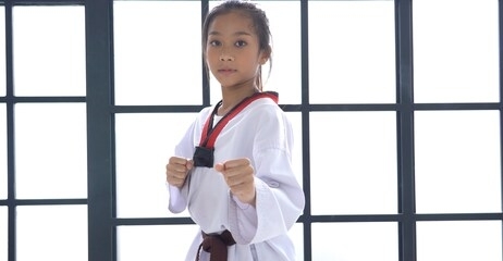 portrait asian girl taekwondo in studio