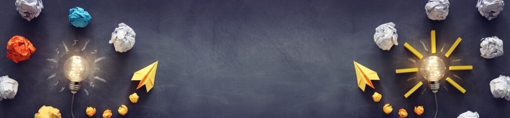 education concept image. creative idea and innovation. light bulb as metaphor over blackboard