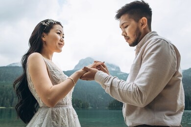 the kazakh groom puts on a wedding ring on the finger of the kazakh bride.