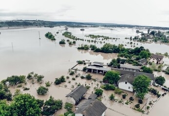 flooded village on ukraine. natural disaster in halych, courtyards and streets in dirty yellow water. global catastrophe, climate change, flood concept