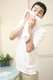 japanese man wiping the face