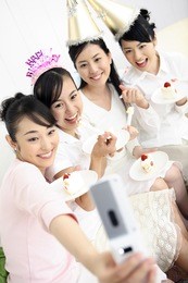 group of japanese females eating cake at a birthday party