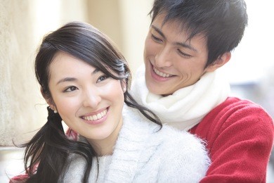 japanese man embracing his girlfriend