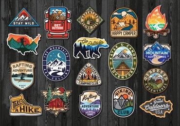 set of vintage outdoor summer camp logo patches on wood board. hand drawn and vector emblem designs. great for shirts, stamps, stickers logos and labels.