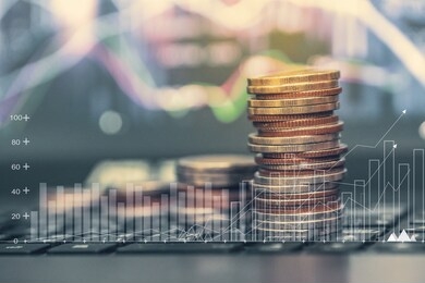 concept finance/ saving money for future growth.financial stock market graph and rows of coins growth. business investment and currency exchange and capital gain in a long-term growth