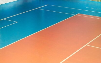 empty gym with volleyball court, marking on the floor for sports games.