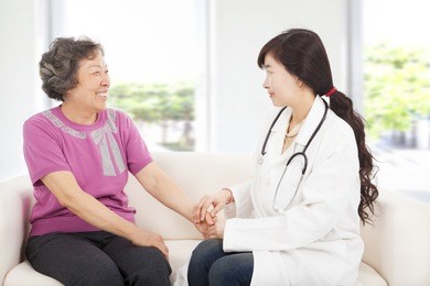 friendly doctor caring senior woman indoor room