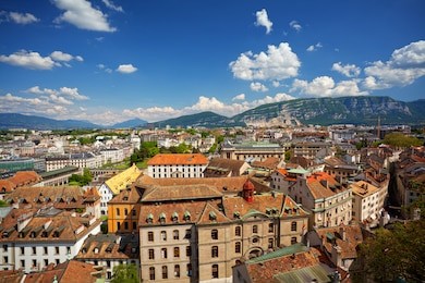 aerial view of old center of geneva with mt. saleve in the background