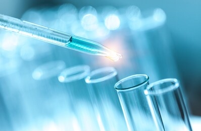 genetic research with test tubes on laboratory background.