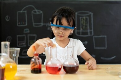 adorable asian little girl is make easy scientific experimental at home, concept of learn from home, child stem education and science for kid.