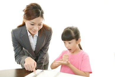 teacher with girl studying.