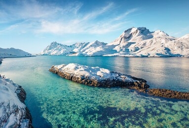 view from flying drone of andopen fjord with kakernbrua bridge on background. incredible winter seascape of norwegian sea. wonderful morning scene of lofoten islands archipelago, norway.
