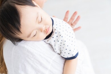 asian sleeping baby and mom