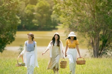 asian girl friends group they are going to picnic. at the park