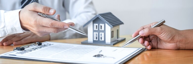estate agent are presenting home loan and giving house to client after discussing and signing agreement contract with approved application form, home insurance and real estate investment concept.