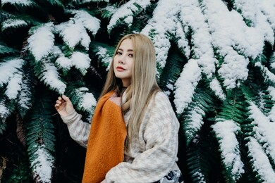 beautiful asian woman enjoy view with snow during winter in new zealand.
