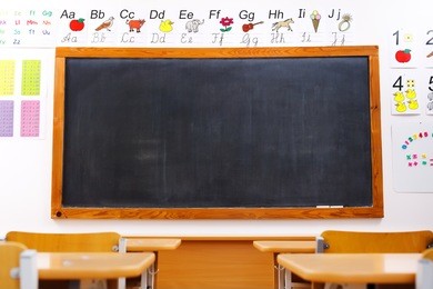 classroom with black chalkboard, educational alphabet and numbers 