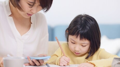 studying asian little schoolgirl. cram school. tutor. education concept.