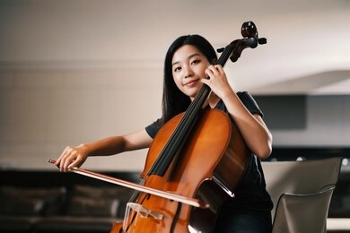 asain musician playing the cello