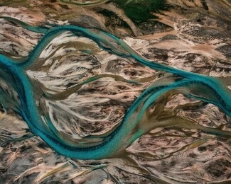 aerial drone view of melting glacier river water in south iceland. abstract nature background
