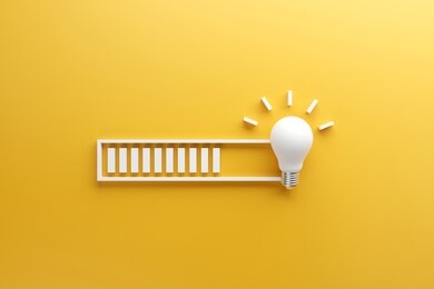 loading bar almost complete with idea beeing processed on a light bulb on yellow background. 3d render.