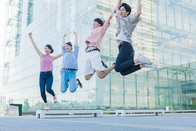 portrait of a college student standing in the green