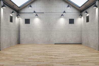 contemporary brick warehouse interior with wooden floor. design and style concept. mock up, 3d rendering