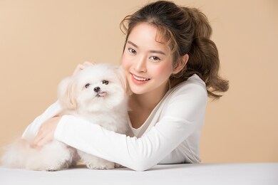 beautiful asian woman with cute dog, isolated on brown background