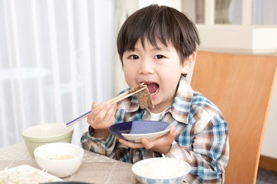 japanese boy eating meat