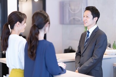 portrait of three asian men and women in the room